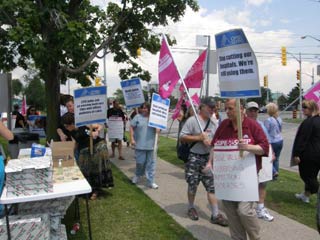 OPSEU members holding signs