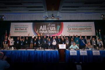 OPSEU's Executive Board hold hands up together during Convention 2017 Day 3