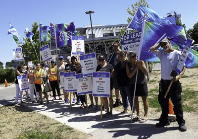 OPSEU Local 276 members picket outside of Owen Sound Family Health Organization.