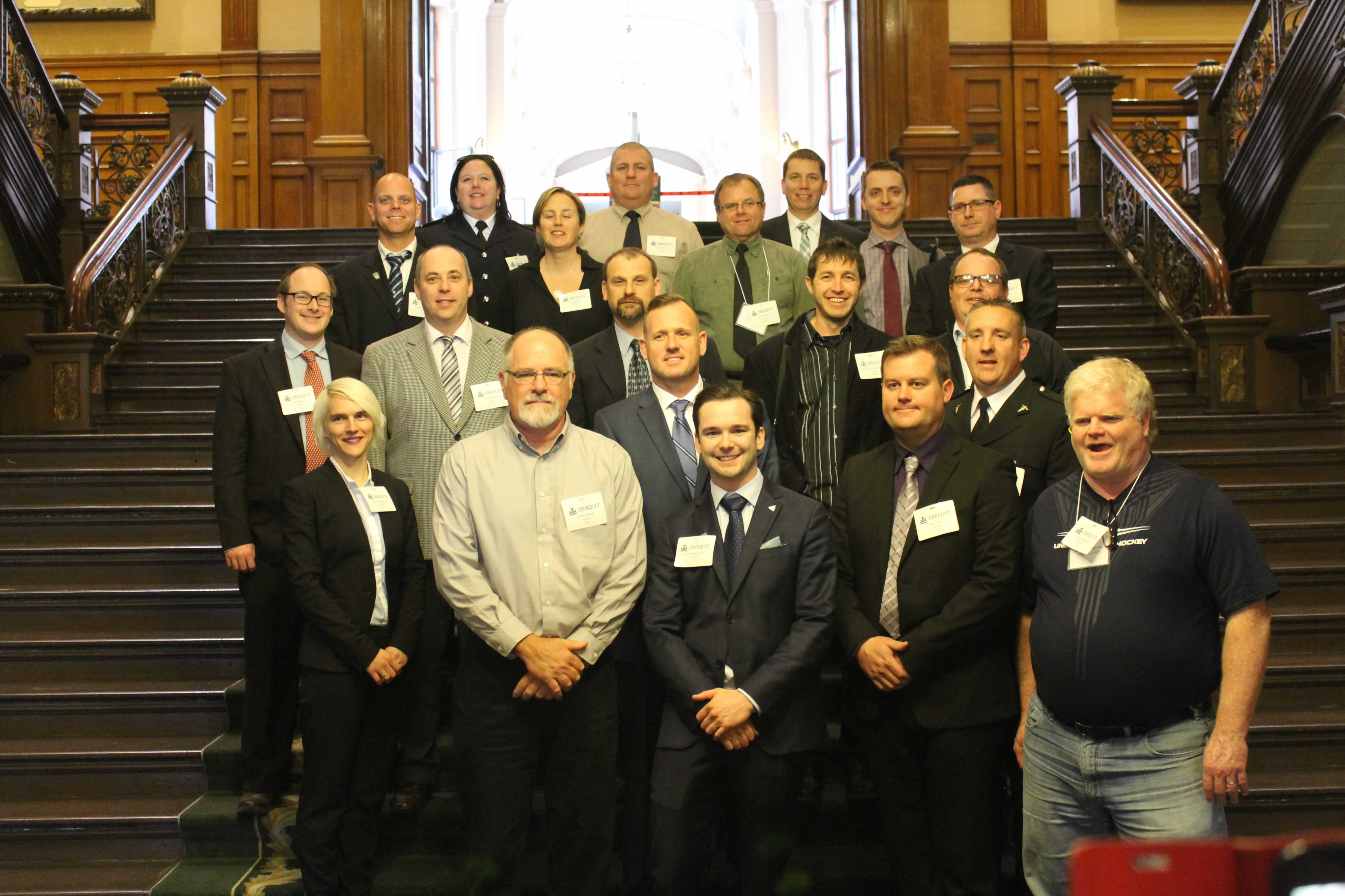 OPSEU Paramedic members pose on the stairs at Queen's Park during a lobby day.