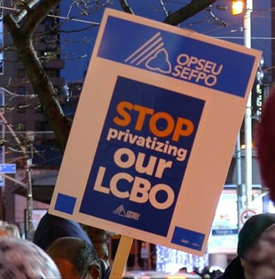 Picket sign reading "Stop privatizing our LCBO" at a rally.