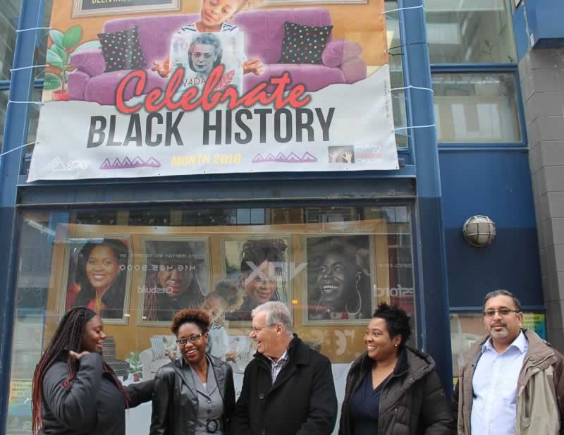 OPSEU President Warren (Smokey) Thomas with members beneath a Celebrate Black History Month banner