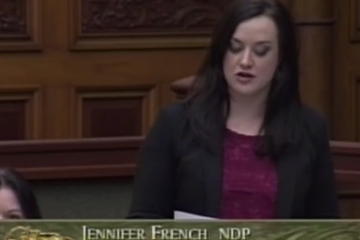 NDP MPP Jennifer French speaks in Queen's Park with a caption that says "Jennifer French NDP Oshawa"