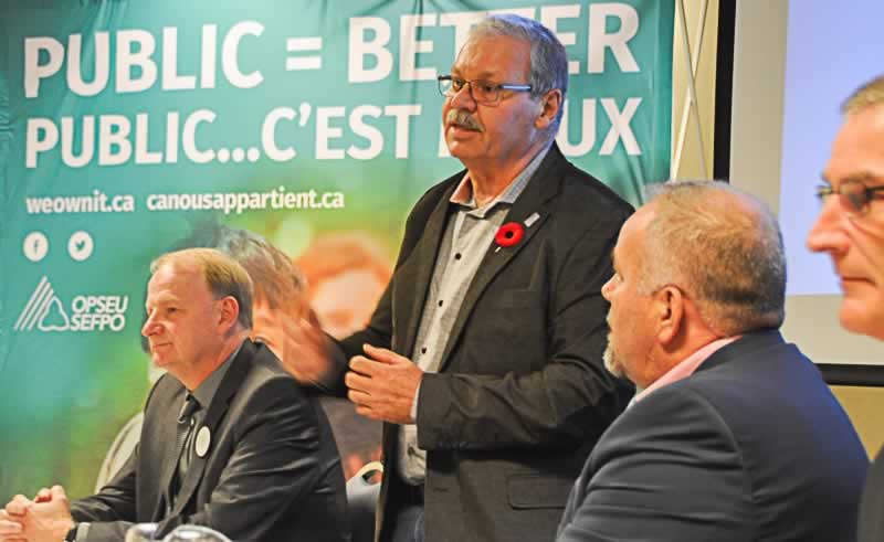 OPSEU President Warren (Smokey) Thomas speaks during a We Own It town hall in Belleville