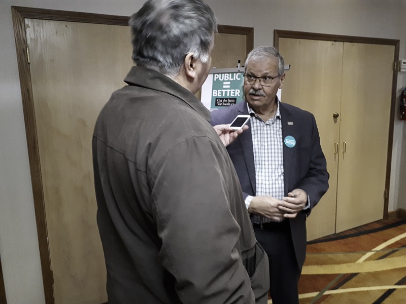 OPSEU President Warren (Smokey) Thomas speaks to a reporter after the Kenora We Own It town hall