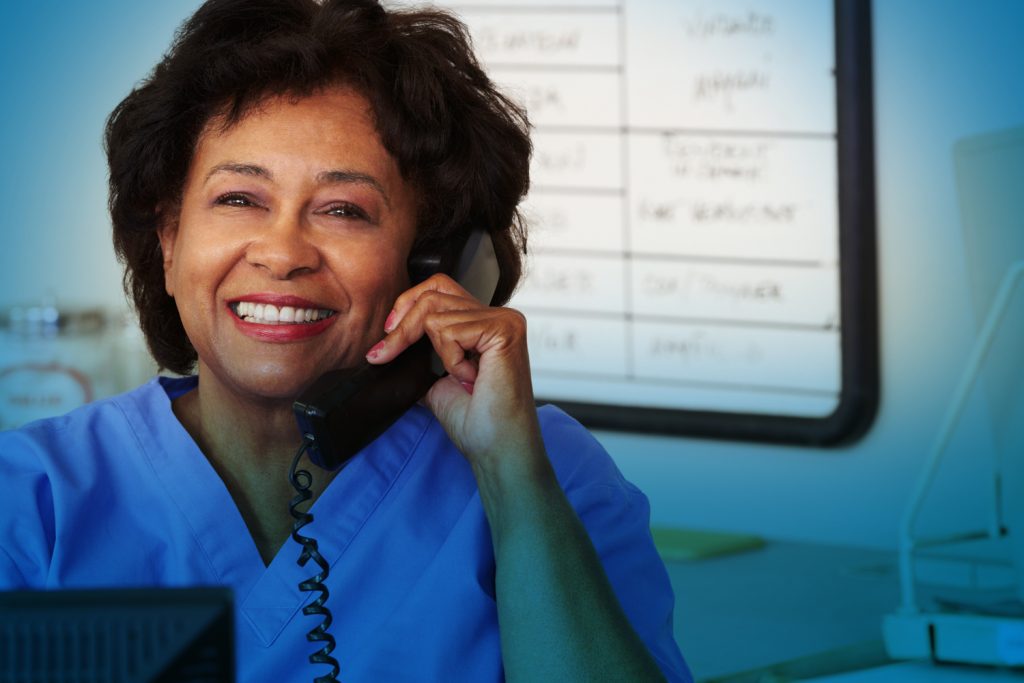 Healthcare worker holding phone