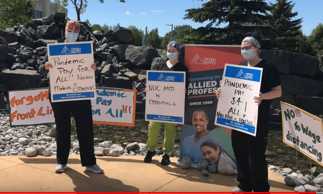 HPD rally on June 12, 2020 at the Thunder Bay Hospital. Shot of workers holding signs